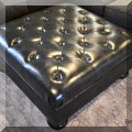 F11. Leather blend tufted ottoman. 18"h x 39"w x 39"d 